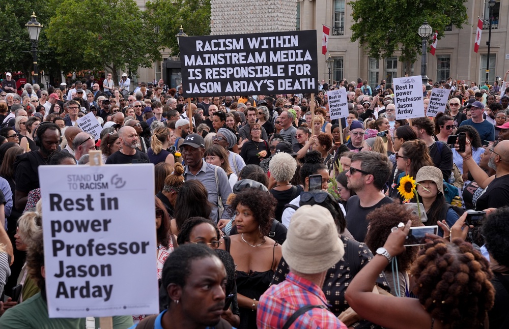 People take part in a vigil organised by campaign group Stand Up to Racism (Yui Mok/PA) (PA Wire)