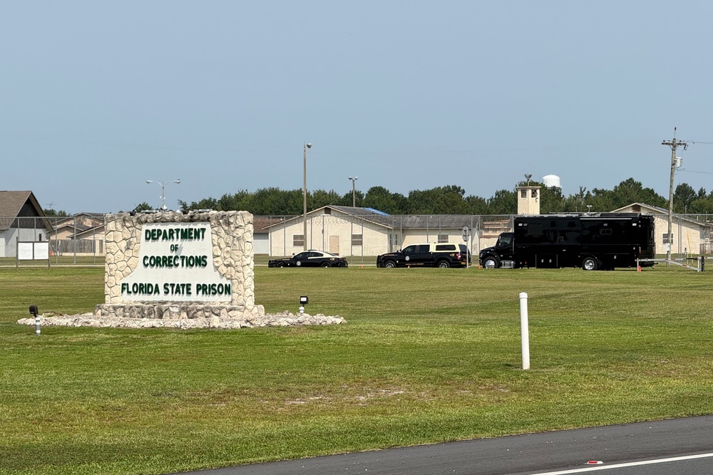 Law enforcement vehicles sit parked outside the Florida state prison in Starke, Fla., on Tuesday, July 28, 2026. (AP Photo/David Fischer, file) (Copyright 2026 The Associated Press. All rights reserved)