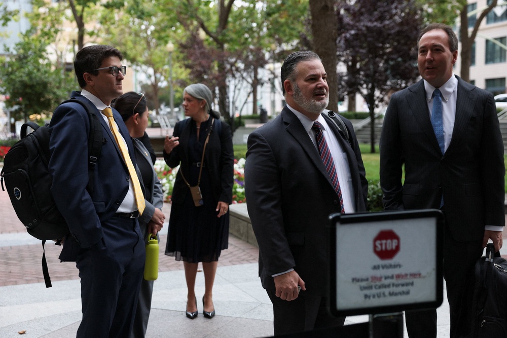 Slothouber and Kentucky’s consumer and senior protection deputy chief Chris Lewis stand in line outside a federal courthouse where a trial over allegations that Meta designed Facebook and Instagram to be addictive to children takes place (Reuters)