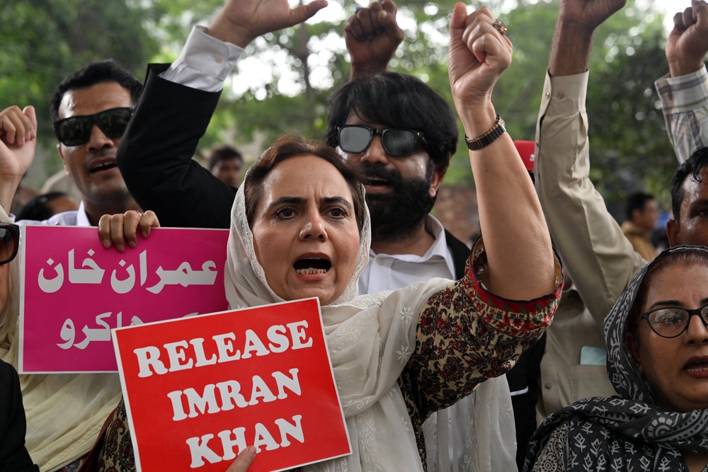 File. Pakistan Tehreek-e-Insaf (PTI) party supporters shout slogans during a protest demanding the release of their jailed leader and the country's former prime minister Imran Khan, in Lahore on 5 August 2026 (AFP/Getty)