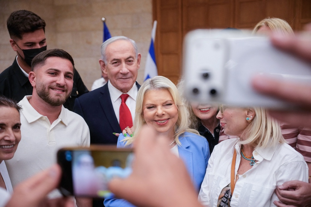 Israeli Prime Minister Benjamin Netanyahu, (C), and his wife, Sara, (C-R) arrive to cast their ballot at his party Likud's main polling station during primary elections ahead of Israel's general election in October in Jerusalem on August 17, 2026. (AFP/Getty)