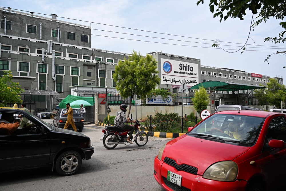 Commuters ride past the Shifa International Hospital in Islamabad on 18 August 2026, after Pakistan's Supreme Court ordered jailed former prime minister Imran Khan's transfer from prison for medical treatment (AFP/Getty)