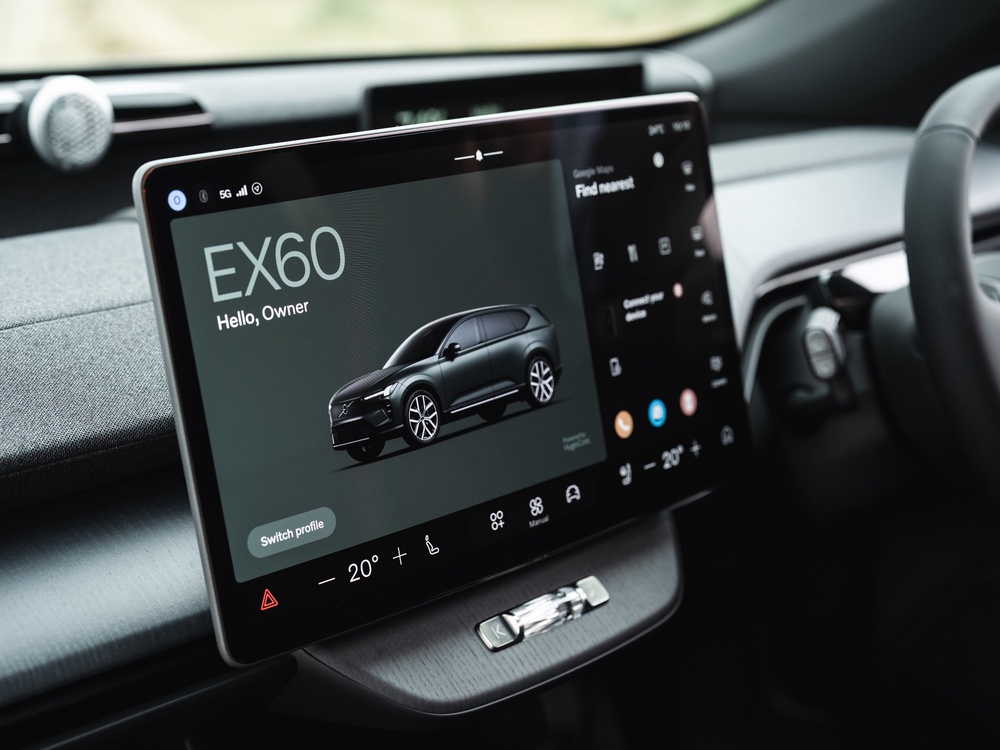 The touchscreen features permanent hard keys for most used functions along the bottom and at the side, while there's a crystal wheel for volume control (Volvo)