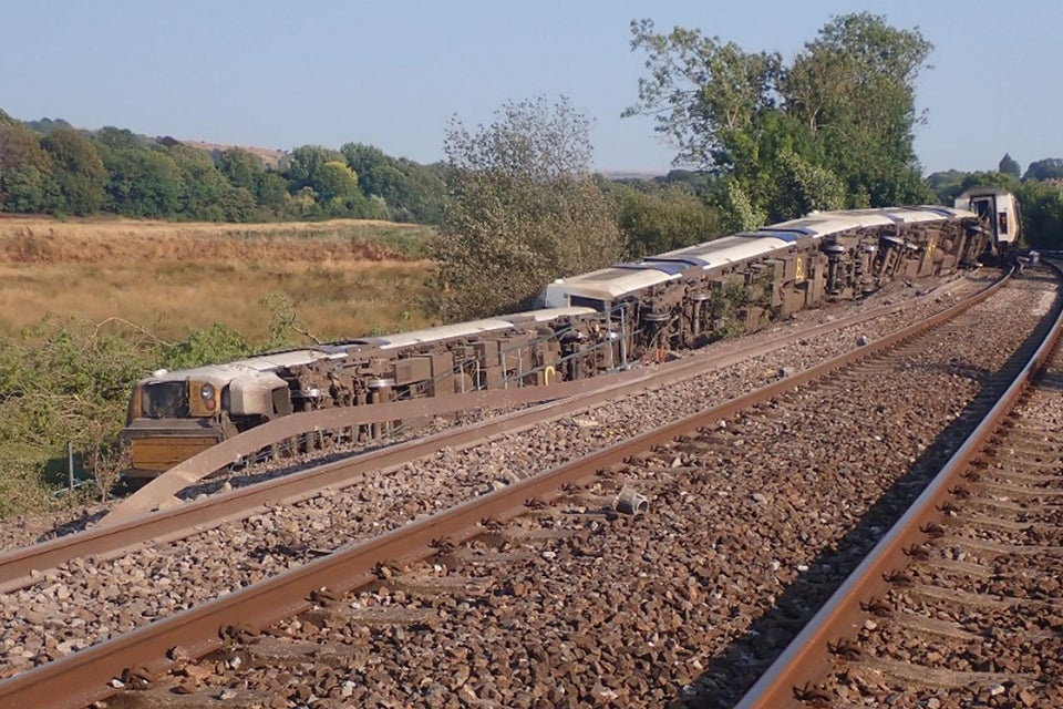 A newly released photograph shows the three carriages on their sides (Rail Accident Investigation Branch)