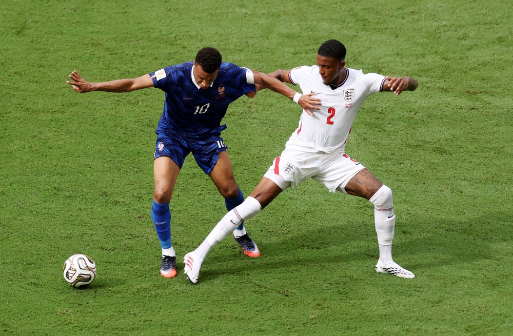 Kylian Mbappe of France and Ezri Konsa of England compete for the ball (Getty)