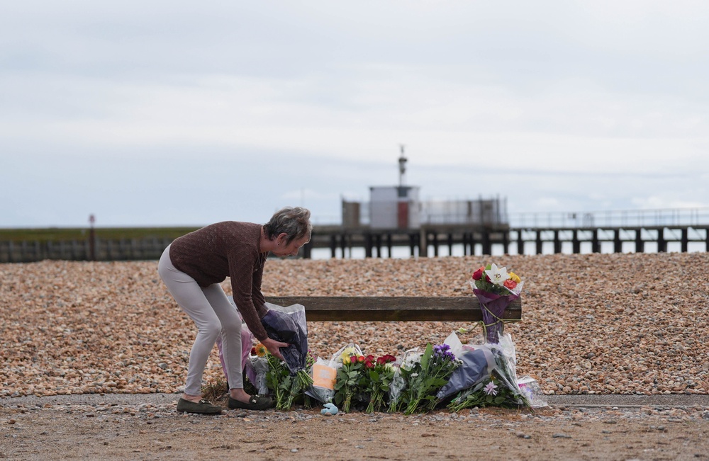 Flowers and tributes being laid at the scene (PA)