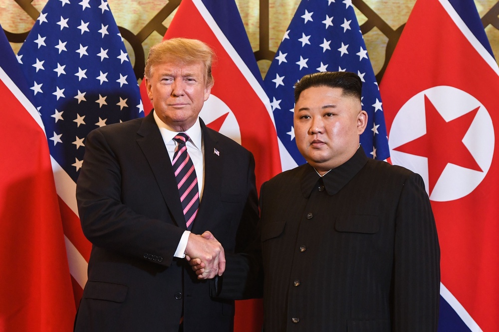 Trump shakes hands with Kim Jong Un before a meeting at the Sofitel Legend Metropole hotel in Hanoi on February 27, 2019 (AFP/Getty)