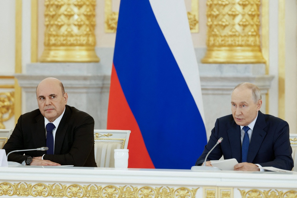 In this pool photograph distributed by the Russian state agency Sputnik, Russia's President Vladimir Putin (R), sitting next to Russian Premier Mikhail Mishustin (L), chairs a meeting of the Council for Strategic Development and National Projects at the Kremlin in Moscow on August 19, 2026. (AFP/Getty)
