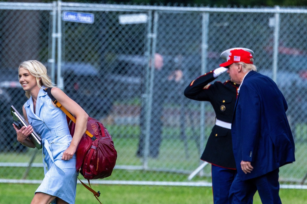 In recent months, Harp has attracted intense media scrutiny, due in part to her near-constant presence at Trump’s side and what some perceive as an unusually fervent devotion to him. Pictured: Trump and Harp walk after landing at the Ellipse near the White House on August 16 (Getty Images)