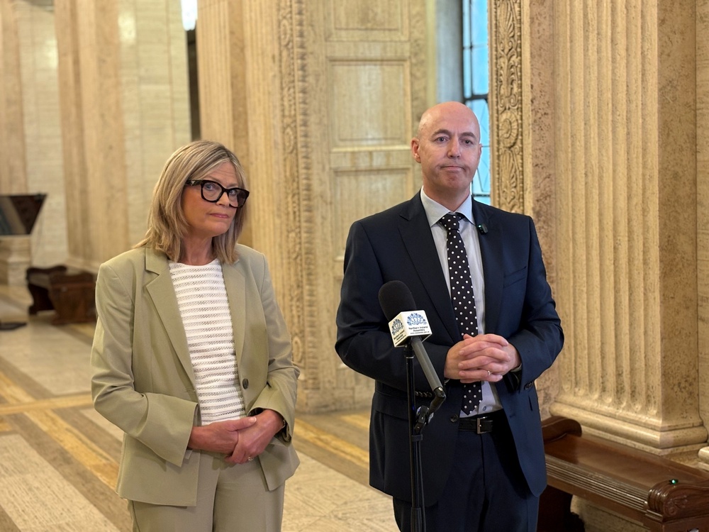 Ulster Unionist leader Jon Burrows speaks to the media, accompanied by deputy leader Diana Armstrong (PA) (PA Wire)