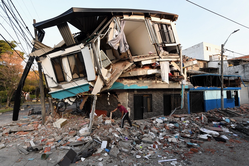 A man removes the debris of a collapsed house after an earthquake in Pereira, Colombia, earlier this month. The earthquake there was one of the country’s largest in year (AFP via Getty Images)