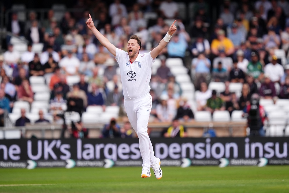 Ollie Robinson celebrates trapping Azan Awais lbw with the first ball of the match (Mike Egerton/PA) (PA Wire)