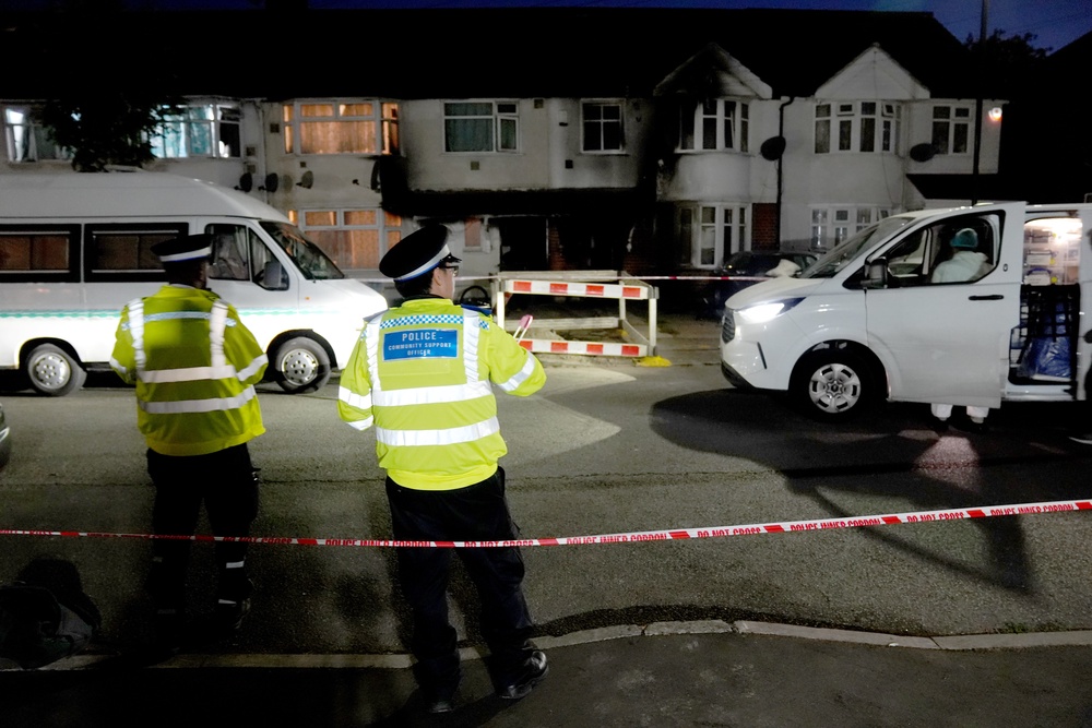 Police outside the property (Ben Whitley/PA) (PA Wire)