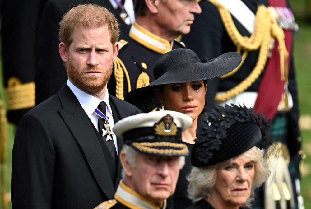 FILE PHOTO: Britain's Meghan, Duchess of Sussex, reacts as she, Prince Harry, Duke of Sussex, Queen Camilla and King Charles attend the state funeral and burial of Britain's Queen Elizabeth, in London (Reuters)