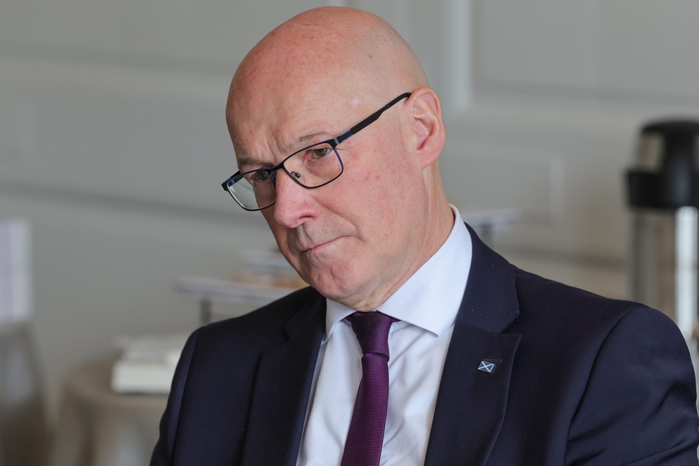 First Minister John Swinney paid tribute to Dolly Parton (PA)