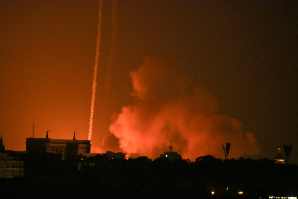 Trails of smoke seen as missiles hit Kyiv region in early morning attack (AFP/Getty)