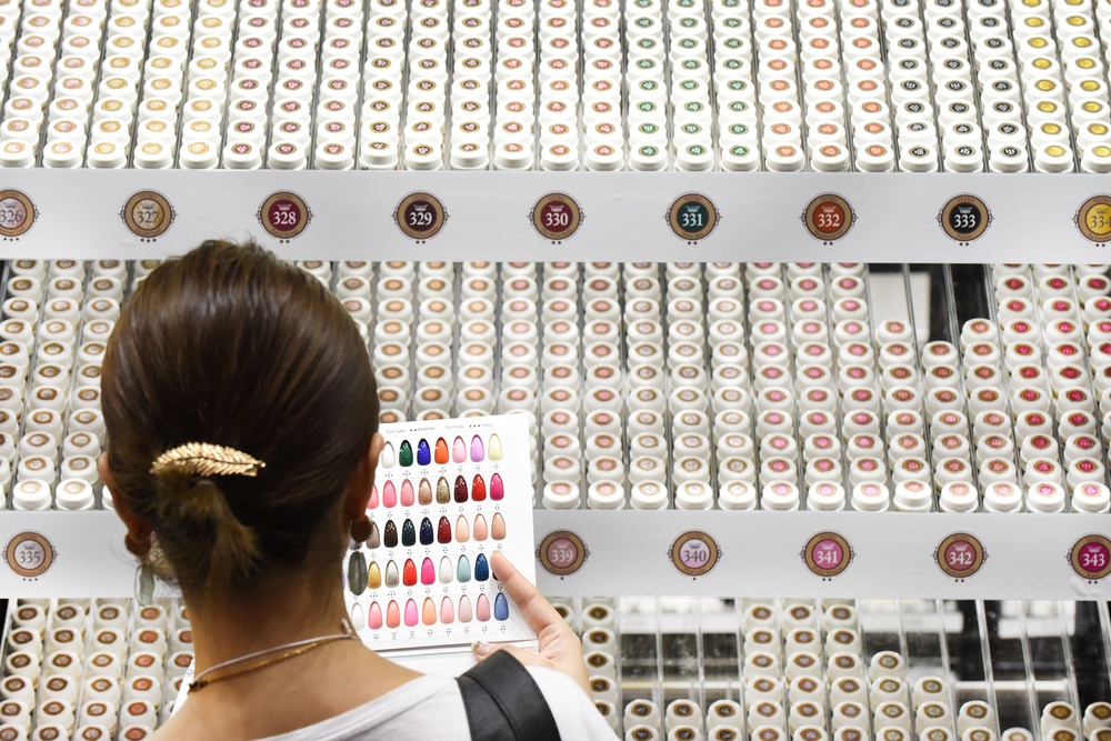 A woman checks color samples of nail gel during the Tokyo Nail Forum (AFP/Getty)