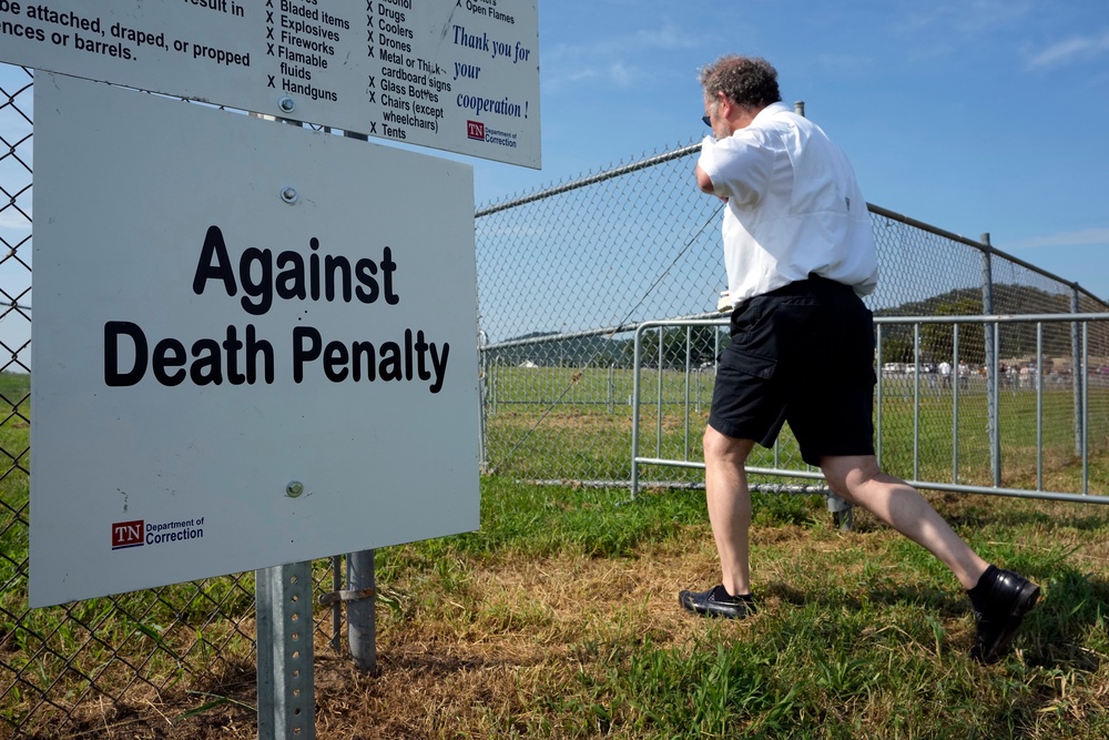 File. A man enters the area reserved for protesters opposed to the death penalty outside Riverbend Maximum Security Institution, 13 Aug 2026, in Nashville, Tenn (AP)