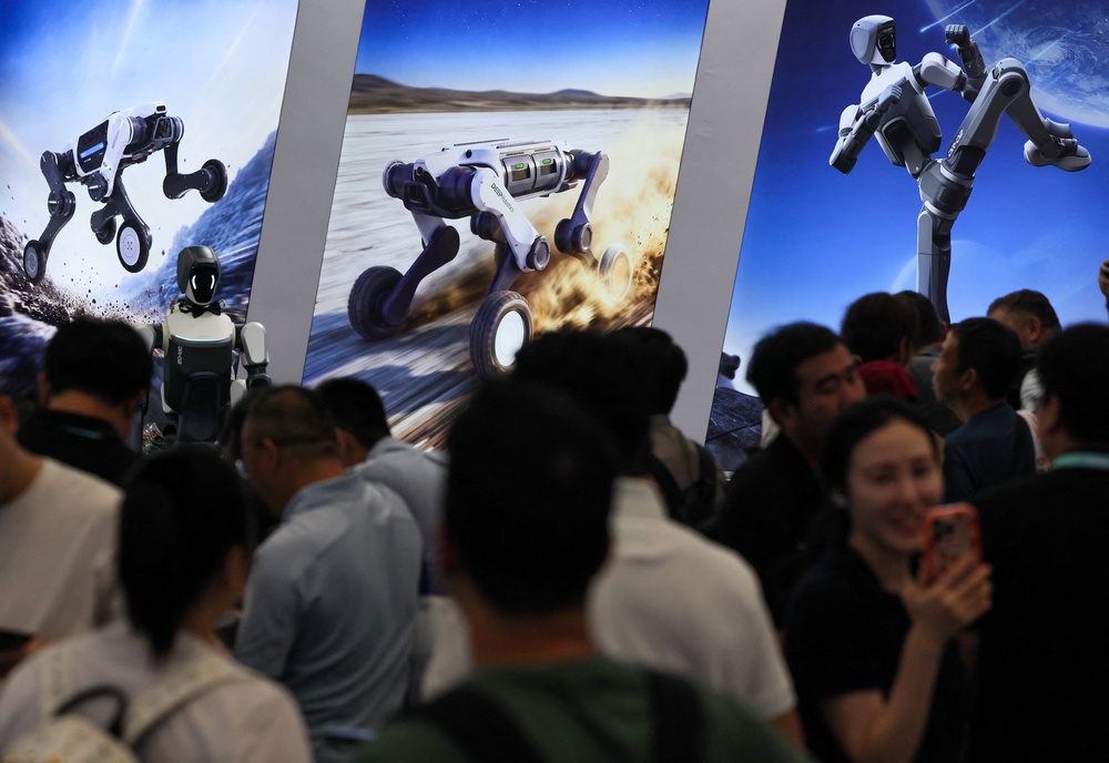 People gather next to Deep Robotics banners promoting the company's robots at the 2026 World Robot Conference, in Beijing, China, August 20, 2026. REUTERS/Maxim Shemetov (Reuters)