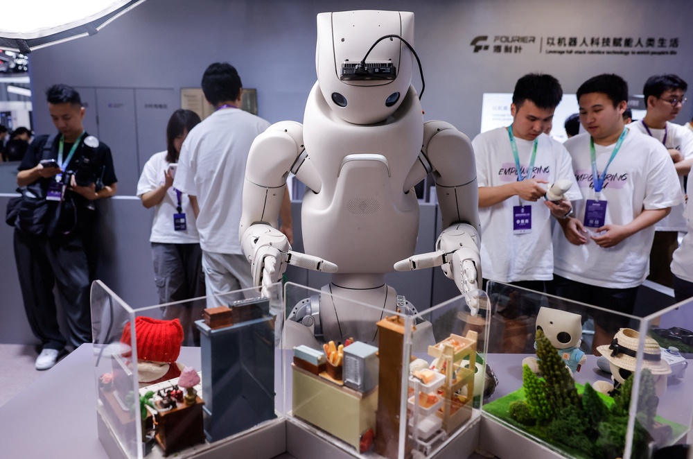 A Fourier Intelligence GR-3 humanoid robot gestures at the company's booth at the 2026 World Robot Conference (Reuters)