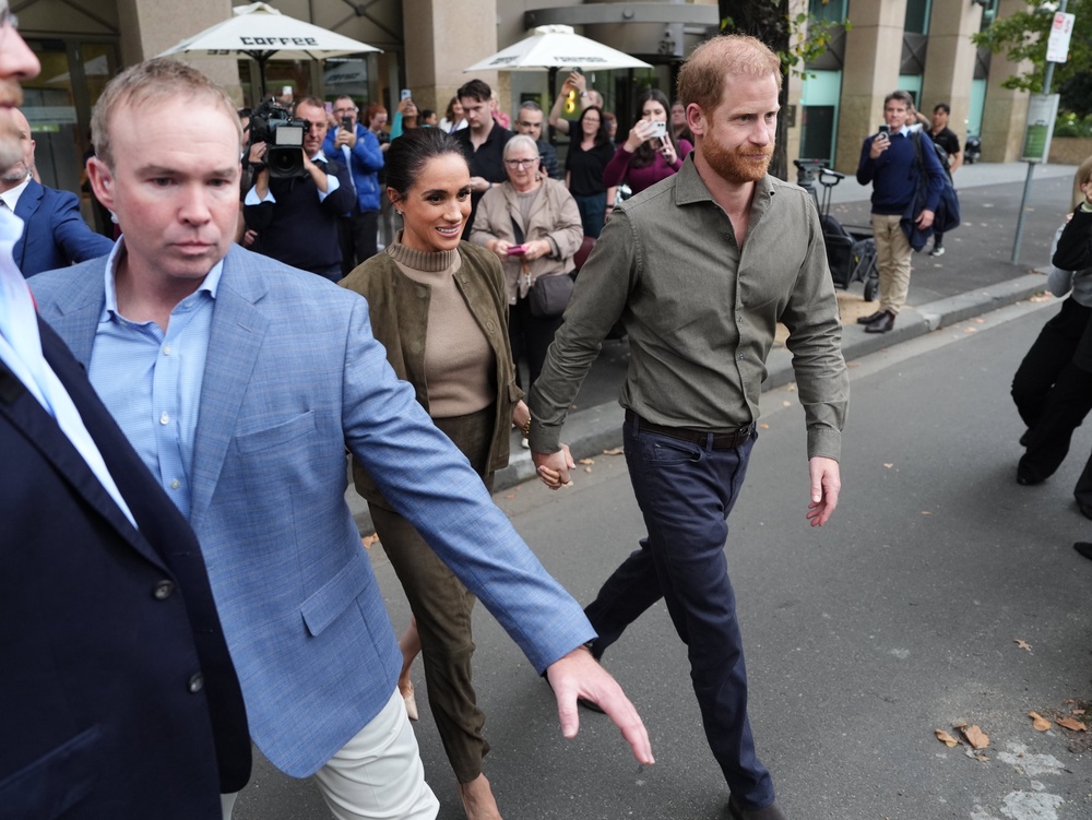 The Sussexes, accompanied by their security, leave the Australian National Veterans Arts Museum in Melbourne in April (Jonathan Brady/PA) (PA Wire)