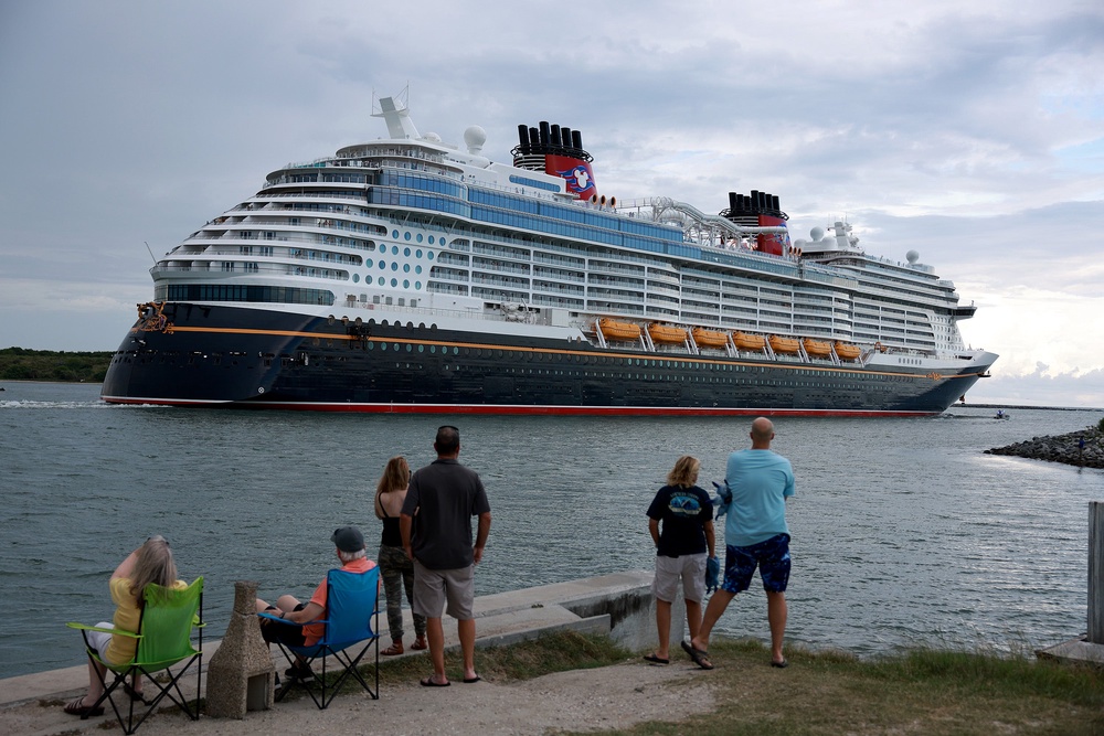 A new lawsuit claims the 'excessively bright' theater lights aboard the Disney Wish, seen here leaving Port Canveral Florida, caused a disoriented passenger to fall down the stairs (Getty)