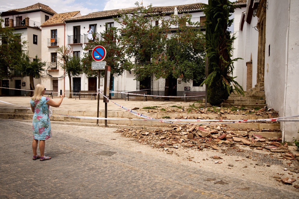 A tourist takes pictures of broken tiles at the entrance of San Miguel Bajo Church in Spain’s Granada last weekend. Experts stress that everyone should have a response plan in place before an earthquake strikes (AFP/Getty)