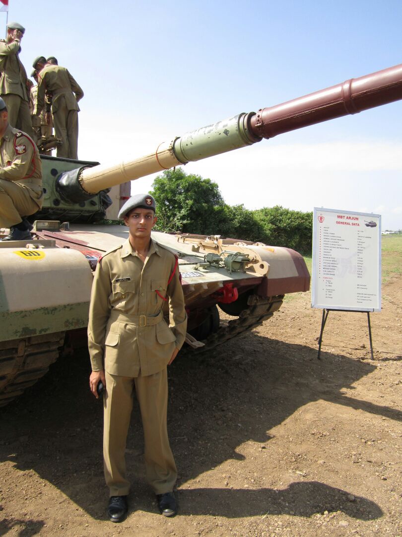 Shubham Gupta in front of a tank during his training at NDA (Supplied)