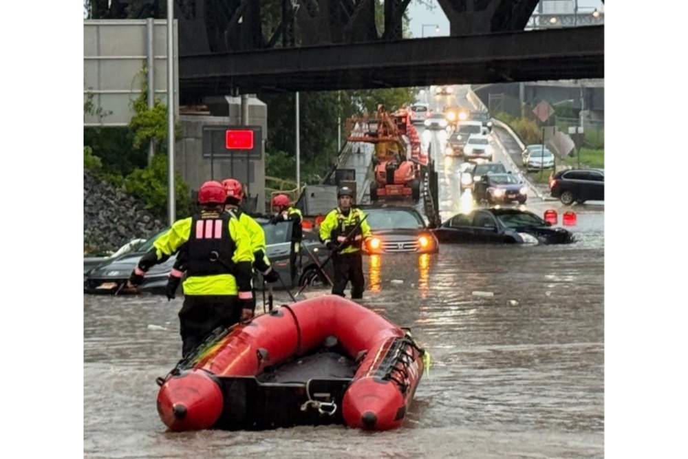 In this photo provided by the City of Jersey City, first responders try to rescue people stranded in Jersey City (City of Jersey City)