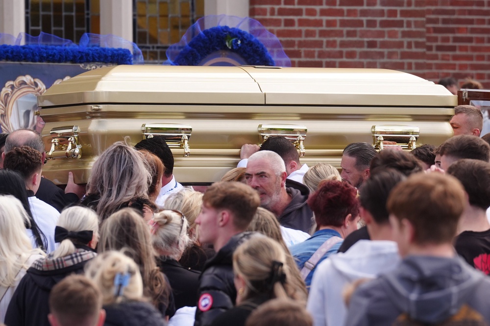 The coffin is carried into St Michael the Archangel Church in Athy for the funeral of Joe Carthy (Brian Lawless/PA) (PA Wire)