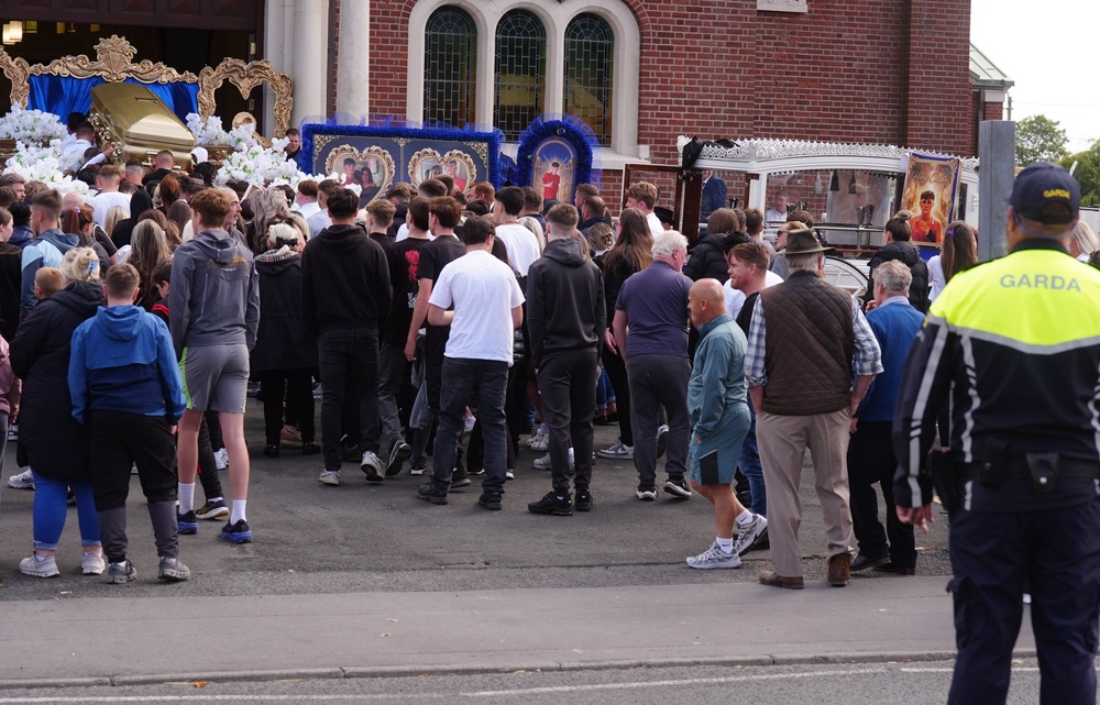 The coffin is carried into St Michael the Archangel Church in Athy (Brian Lawless/PA) (PA Wire)