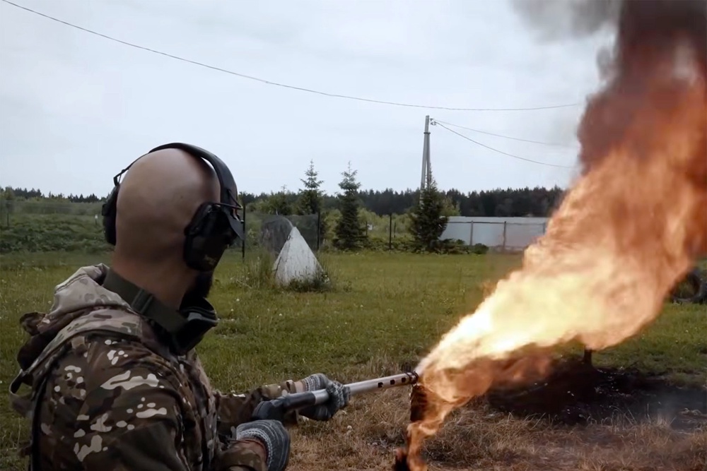 Andrew Tate seen with a flamethrower (Tate Confidential)