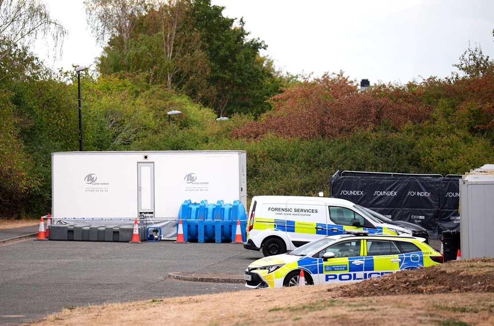 Police vehicles near to the scene (James Manning/PA) (PA Wire)