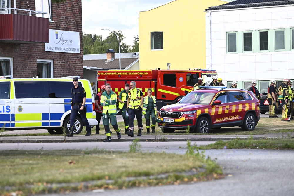 Police and emergency personnel outside Brinellskolan after the sword attack (Fredrik Sandberg/TT News Agency via AP)