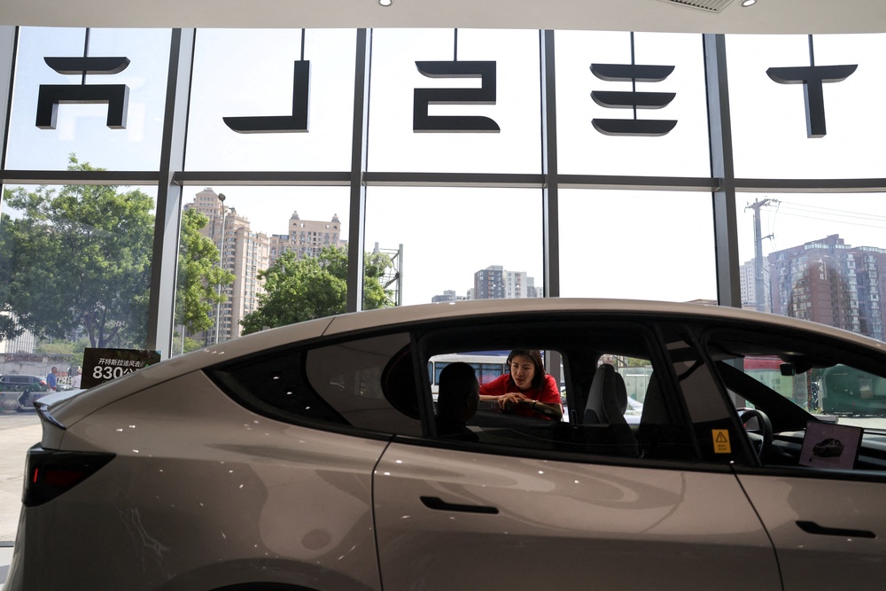 China’s State Administration for Market Regulation said the American manufacturer accounts for roughly 2.98 million imported and locally produced electric vehicles (Reuters/Tingshu Wang)