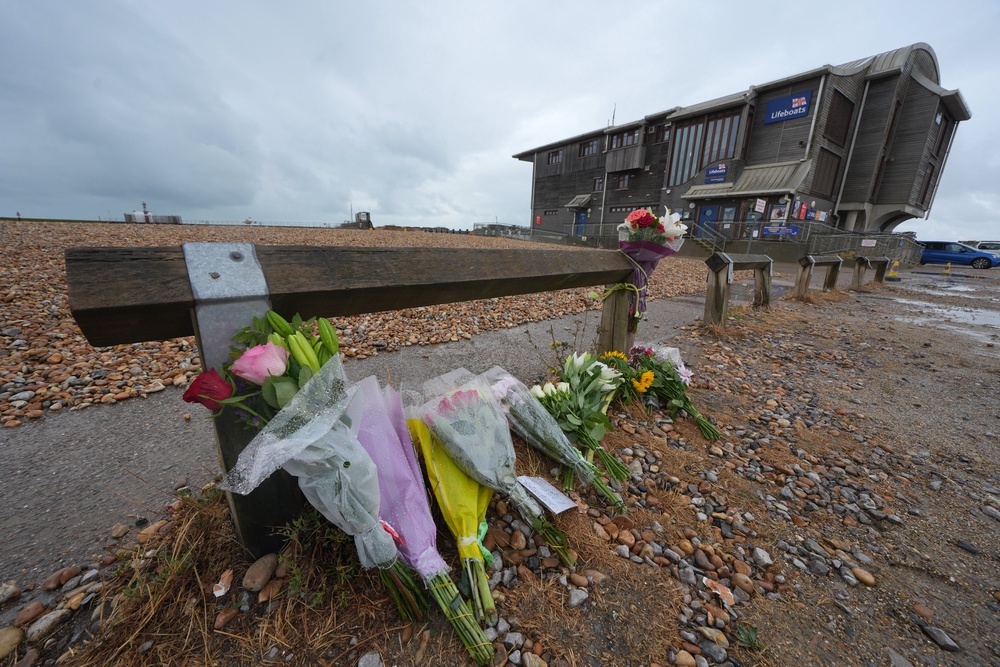 Floral tributes on the beach at Shoreham-by-Sea, West Sussex (Yui Mok/PA) (PA Wire)
