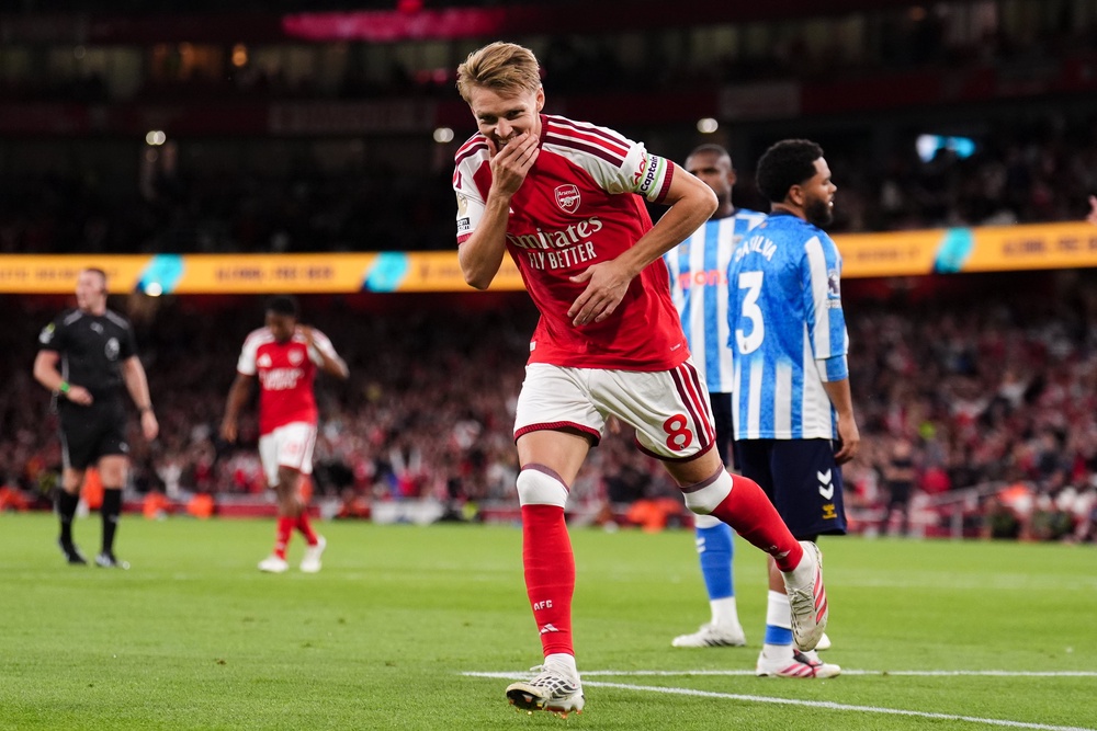 Martin Odegaard and Arsenal were all smiles as they started their title defence with a comfortable win (PA Wire)