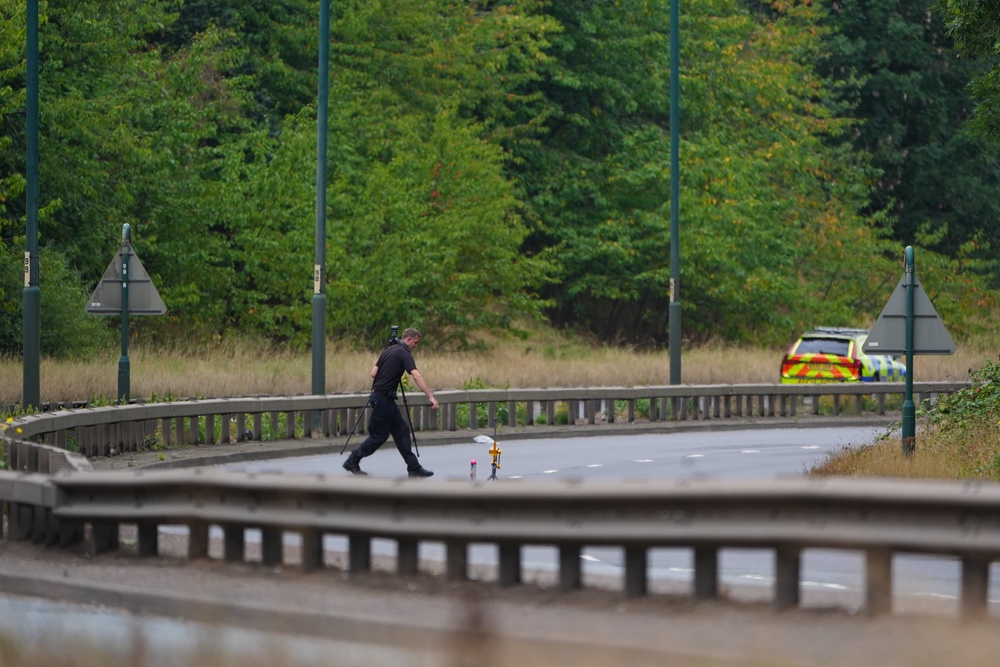 A police officer at the scene of the fatal crash (Owen Humphreys/PA) (PA Wire)