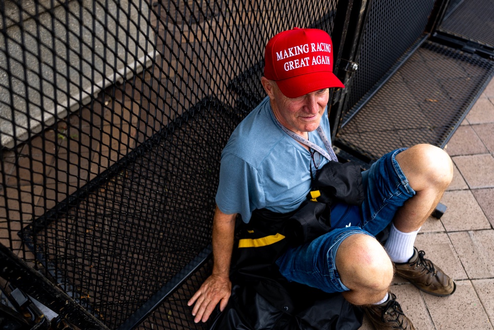 A spectator takes a break while watching the practice rounds of the Freedom 250 Grand Prix Saturday afternoon (Getty)