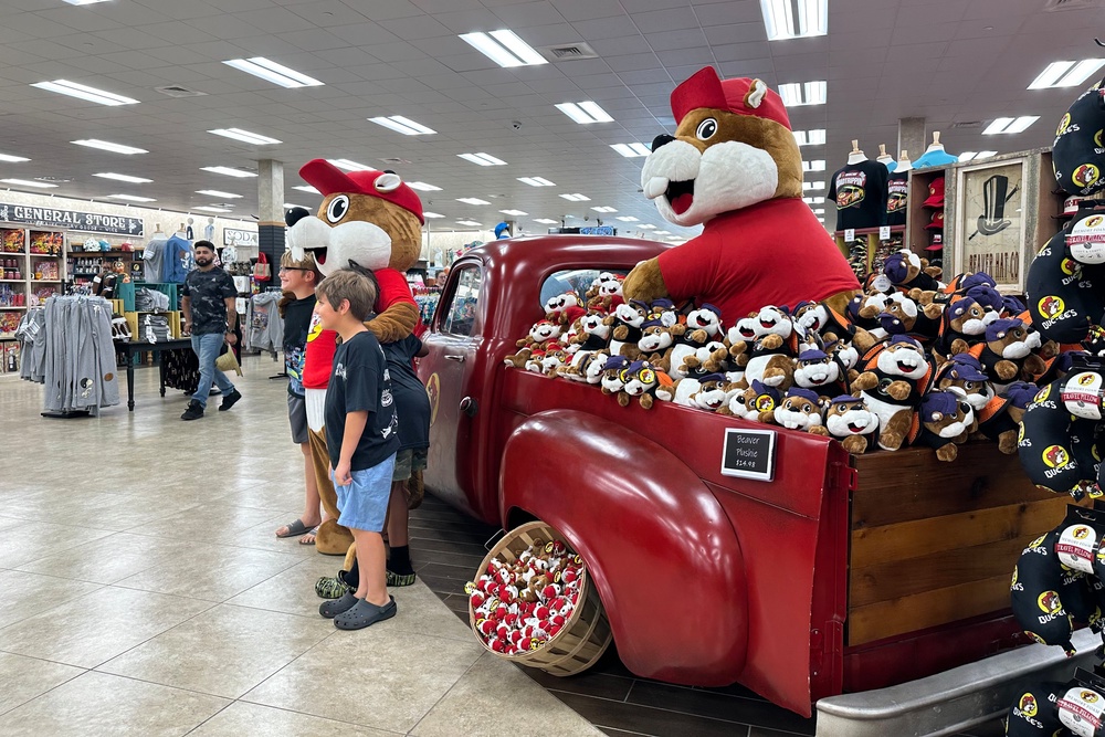 Customers at the Buc-ee's location in Huber Heights, Ohio, pose with the company's mascot (Copyright 2026 The Associated Press. All rights reserved.)