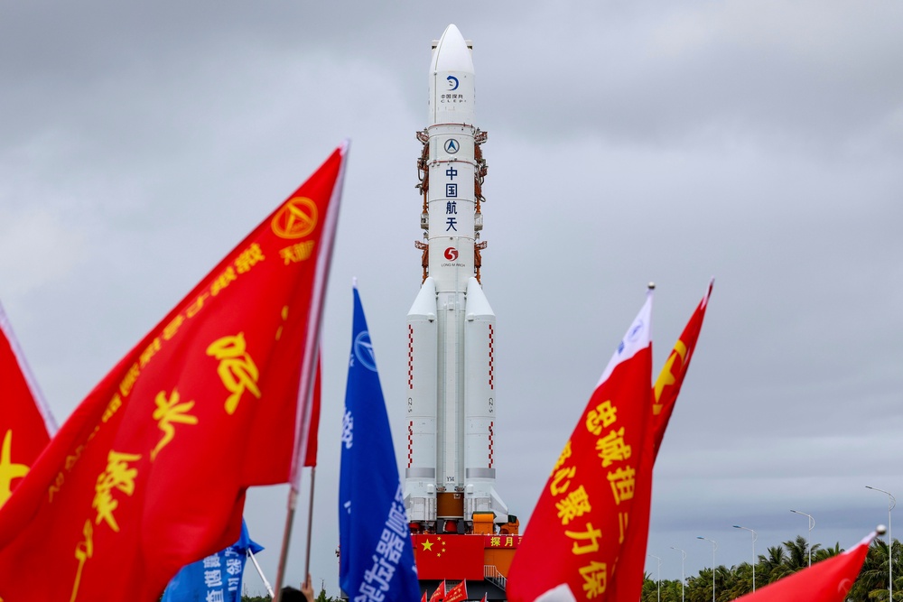 In this photo released by Xinhua News Agency, the combination of the Chang'e-7 lunar probe and the Long March-5 Y14 carrier rocket is transferred vertically to the launching area at the Wenchang Spacecraft Launch Site in southern China's Hainan Province on Wednesday, Aug. 19, 2026 (Xinhua)