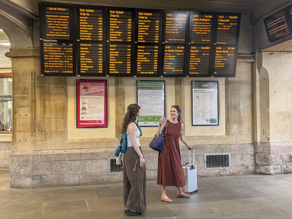 People by the departures boards at Bristol Temple Meads train station after CrossCountry train services have been cancelled (Ben Birchall/PA) (PA Wire)