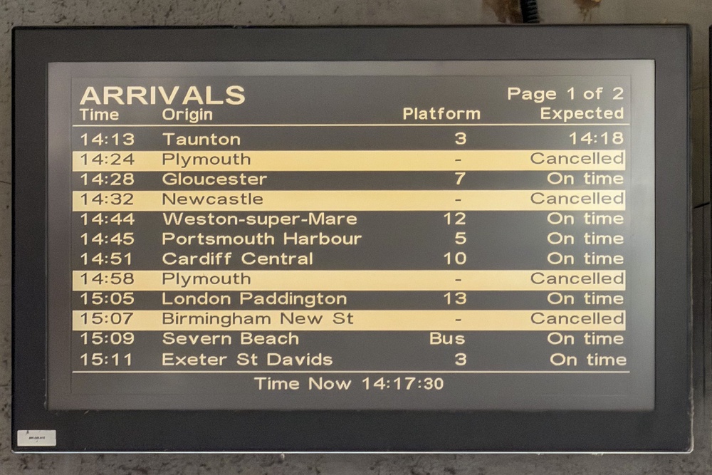 An electronic arrivals board advising passengers of cancelled services (Ben Birchall/PA) (PA Wire)