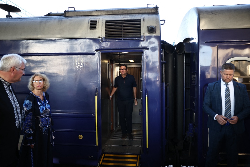 Ukraine's foreign affairs minister Andrii Sybiha prepares to greet prime minister Andy Burnham upon his arrival by train in Kyiv (AFP/Getty)