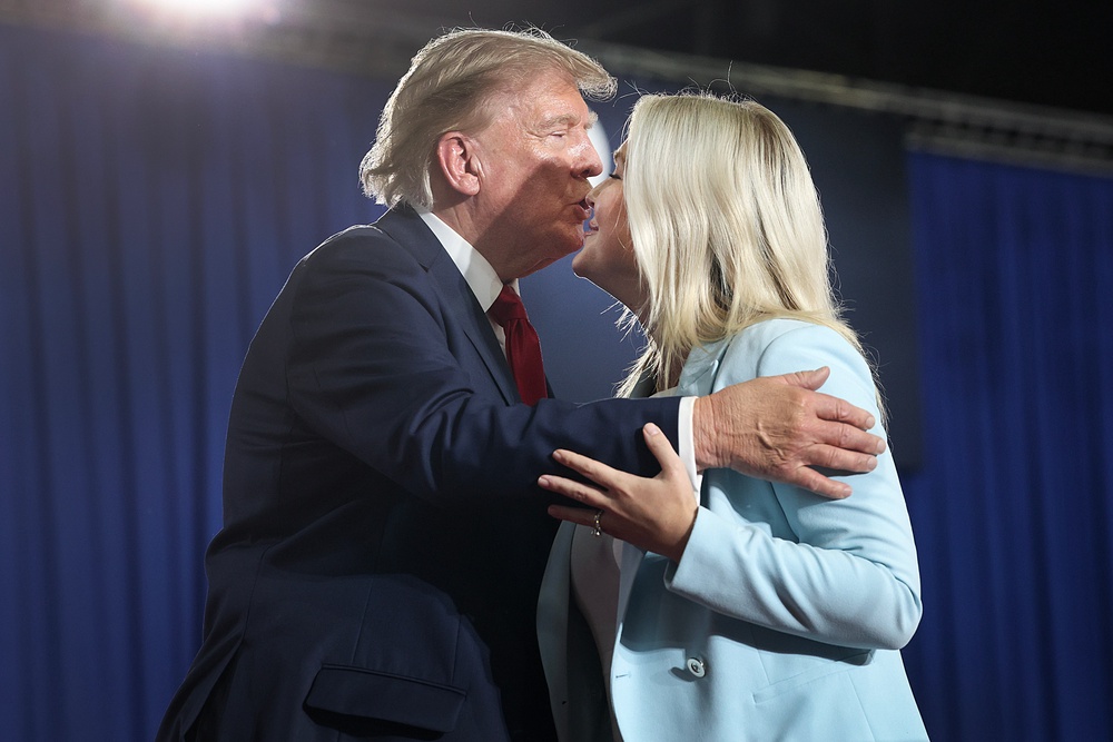Trump greets Press Secretary Karoline Leavitt during a campaign rally with U.S. Sen. Darline Graham (R-SC) on August 21 (Getty)