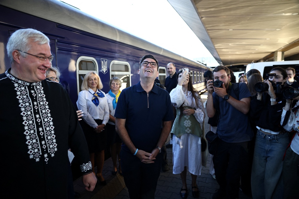 Andy Burnham greets the Ukrainian officials upon his arrival by train in Kyiv (Reuters)