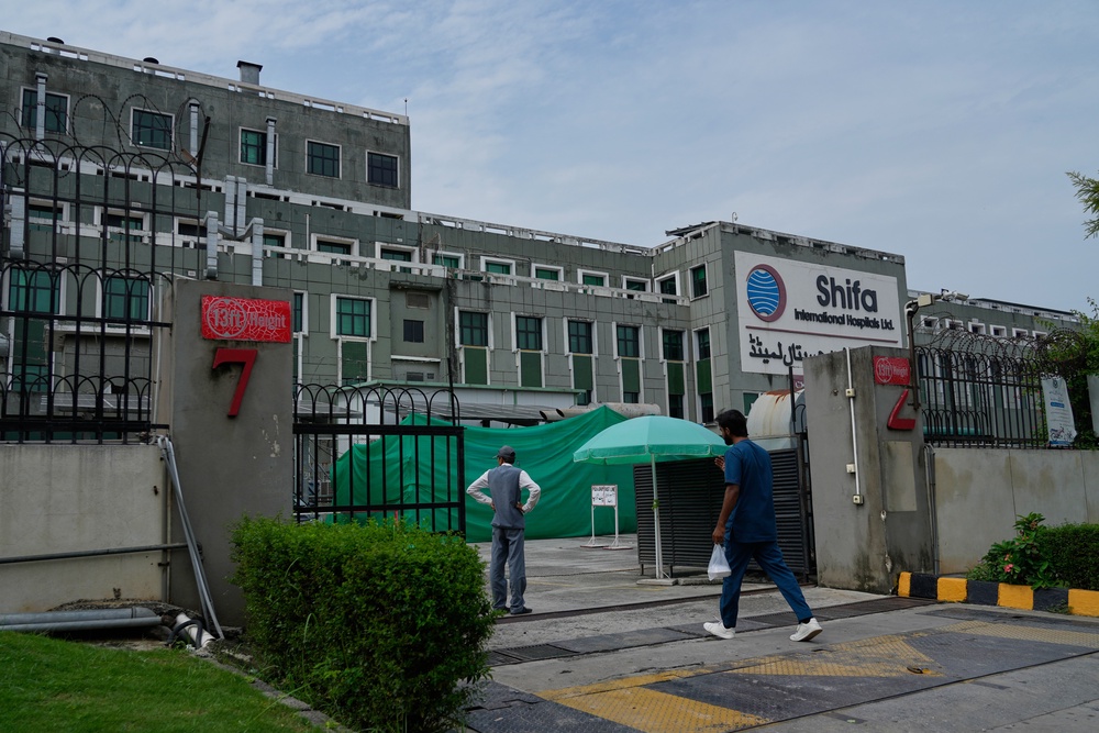 A medical person enters Shifa International Hospital, where imprisoned former PM Imran Khan will be transferred for a medical examination following Pakistan's Supreme Court order in Islamabad (AP)