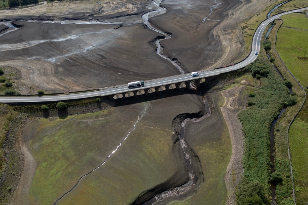 An aerial photograph shows the partially revealed bed of Woodhead Reservoir following a falling water level, near Glossop, northern England (AFP/Getty)