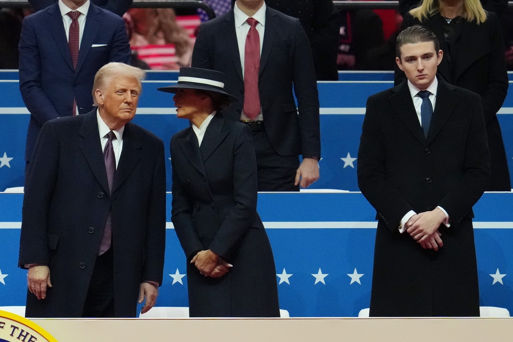 Compared to his older brothers, Barron Trump has kept a relatively low public profile. Pictured: President Donald Trump, first lady Melania Trump and Barron Trump watch during an indoor inauguration parade at Capital One Arena on January 20, 2025 in Washington, DC (Getty Images)