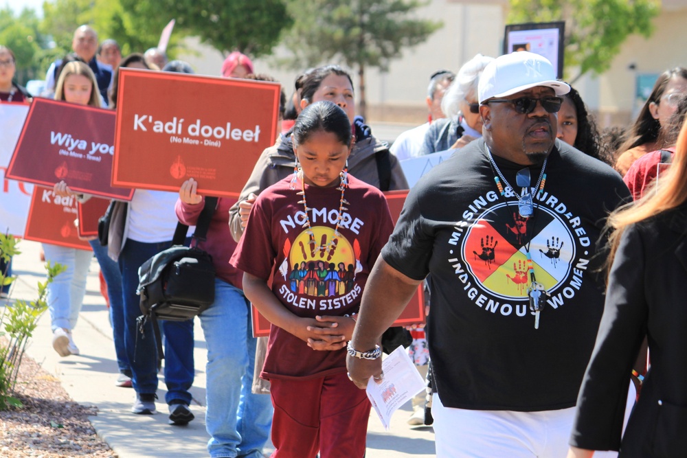 Tize W. Clark, right and his son, Zion Clark, participate in a walk to honor Native American and Indigenous relatives who have gone missing or have been killed as Missing and Murdered Indigenous Persons Awareness Day is marked in Albuquerque (Copyright 2025 The Associated Press. All rights reserved.)